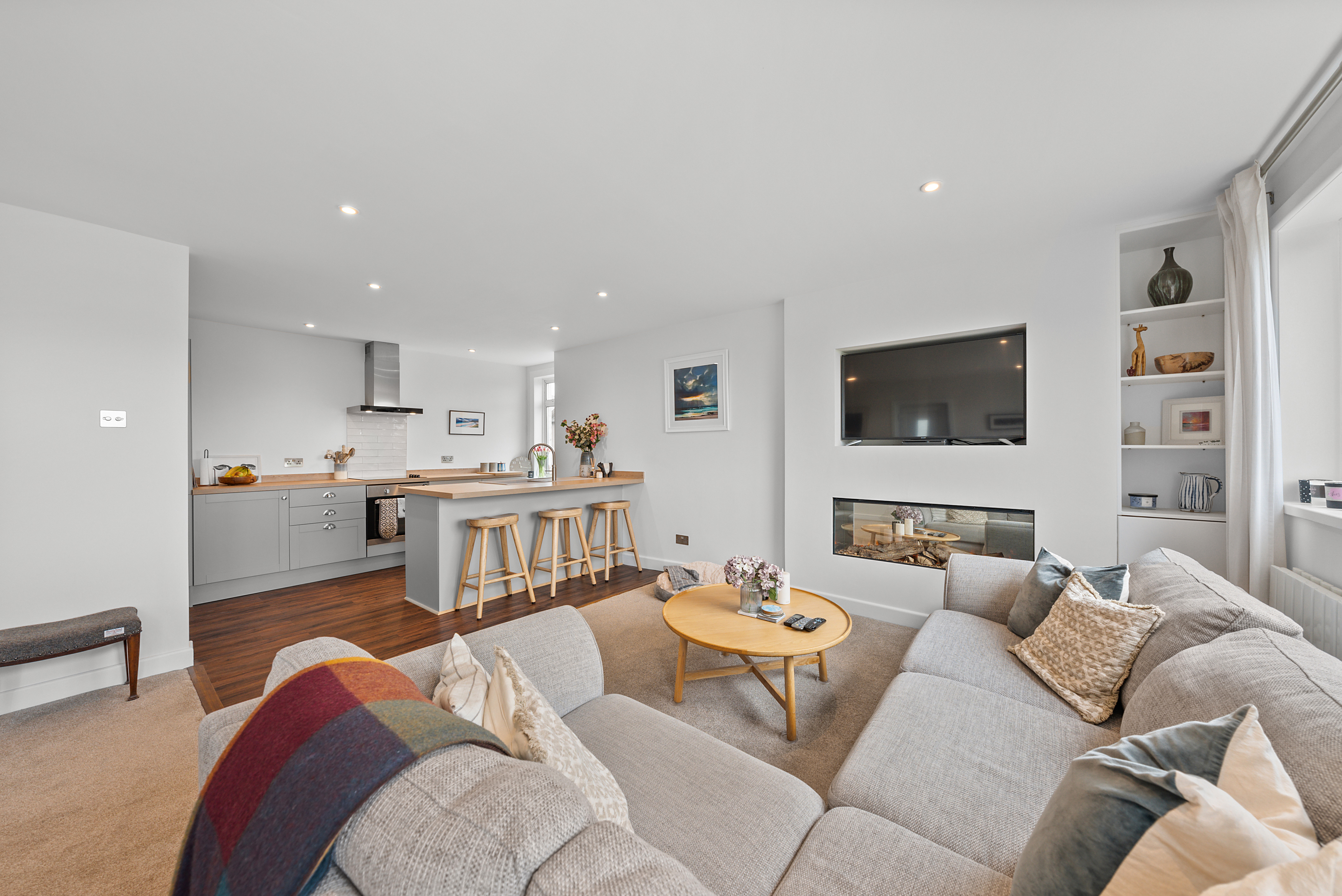 Bright, professionally photographed open-plan living room