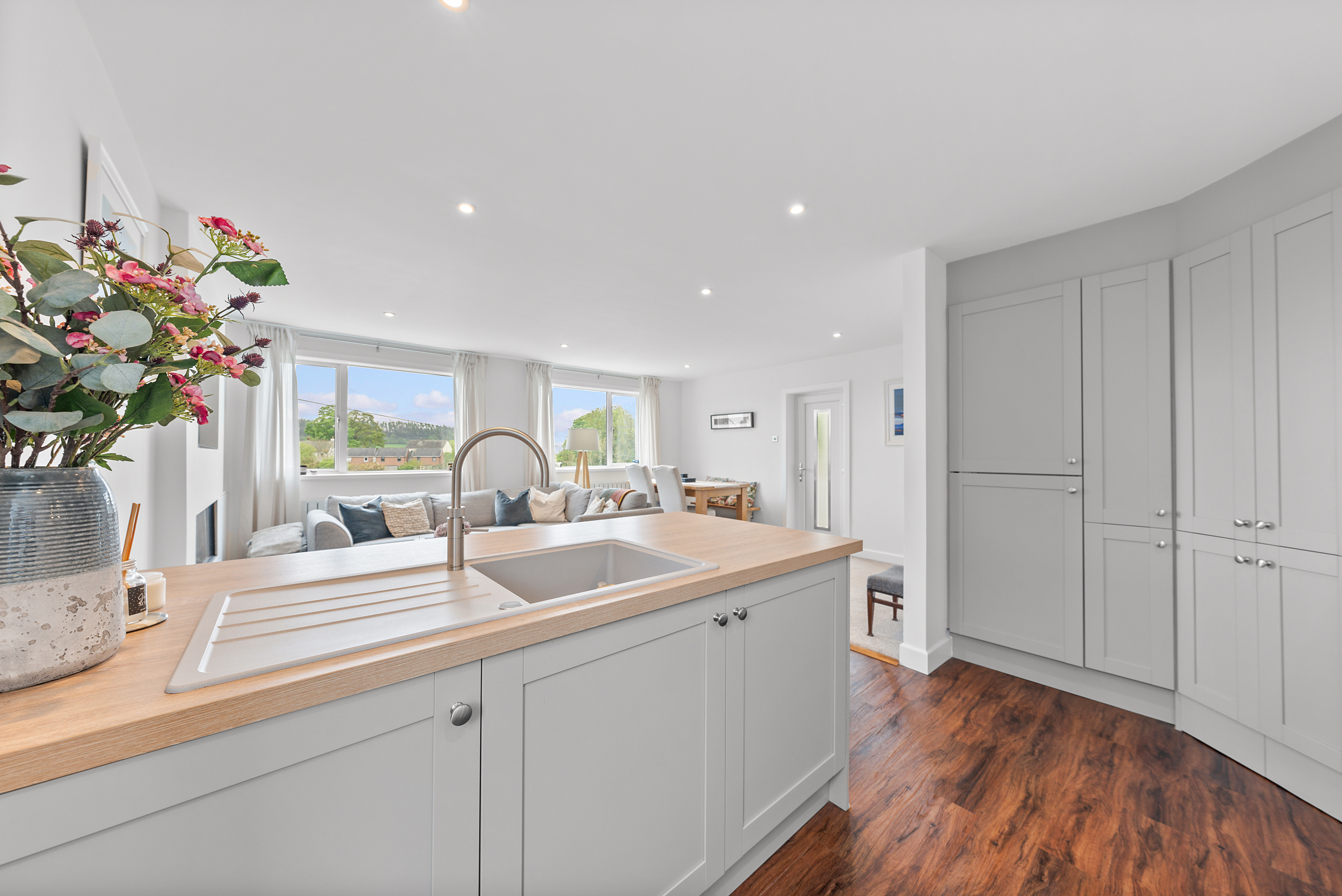 Professionally photographed kitchen with island and breakfast bar